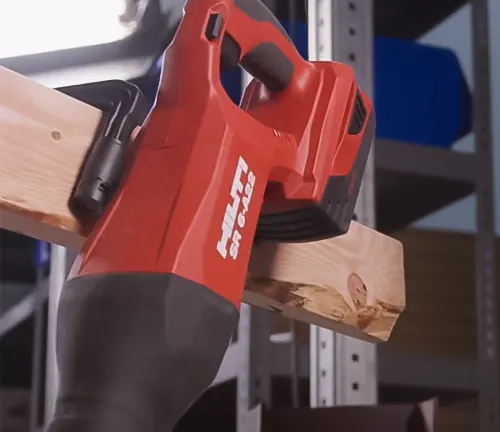 Hilti WSR 1000 Reciprocating Saw in use, cutting through wood on a workbench