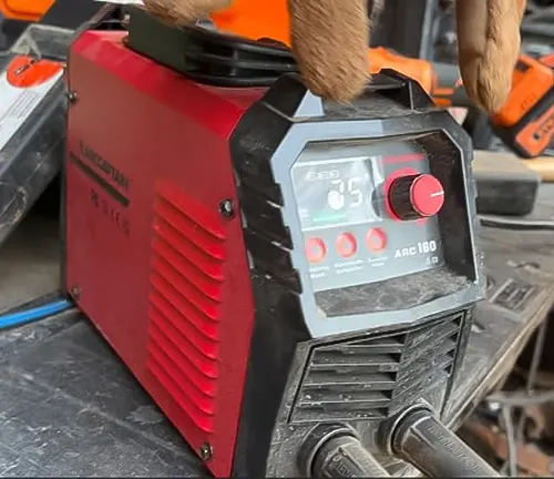 Red HONE Stick Welder 110V/220V Actual 140Amp ARC Welder Machine on a workbench