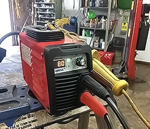 Red HONE Stick Welder 110V/220V Actual 140Amp ARC Welder Machine in a workshop setting