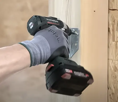 Hand operating Metabo 18V SSD LTX 200 BL Cordless Impact Driver on wood