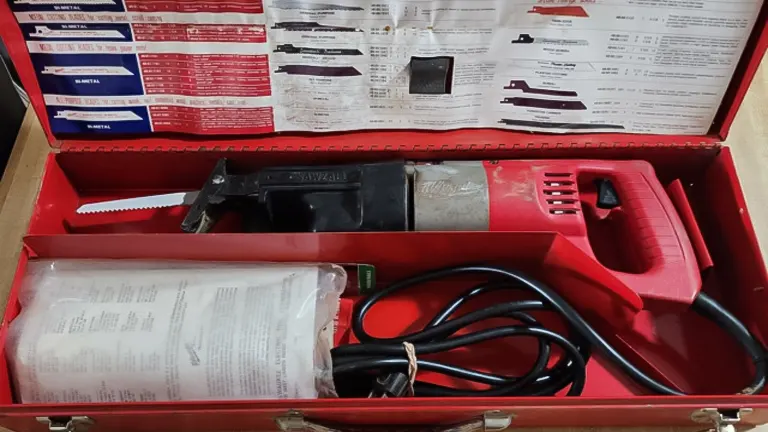 Milwaukee T25741 - 13 Amp Sawzall Reciprocating Saw in a red carrying case with instructions and accessories
