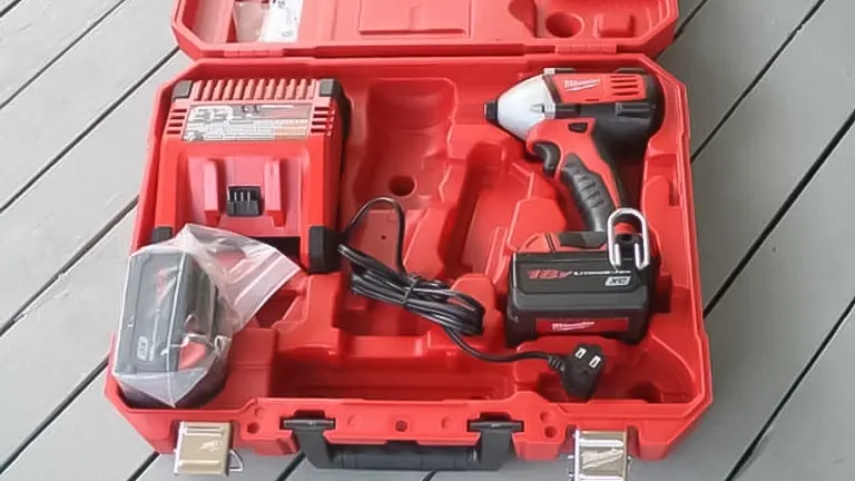Red toolbox with drill and other tools inside.