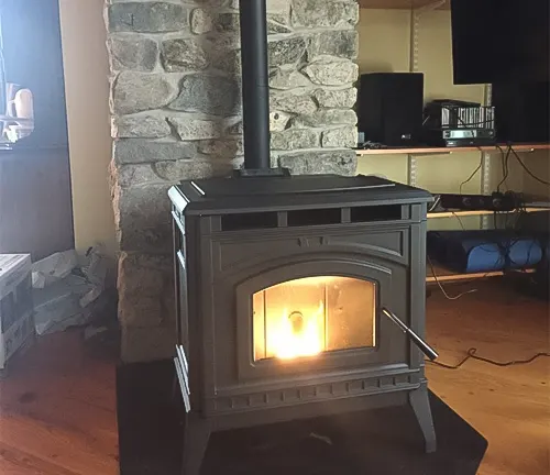 Wood burning stove in a living room with a stone chimney