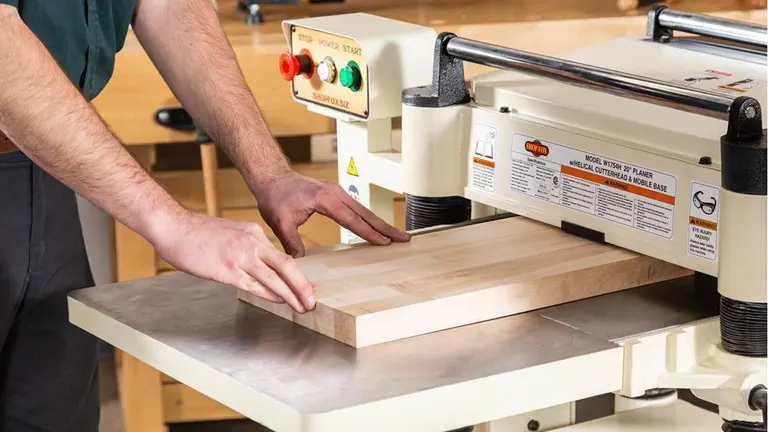 Shop Fox W1754S 20-Inch Planer with Spiral Cutterhead in use in a workshop.