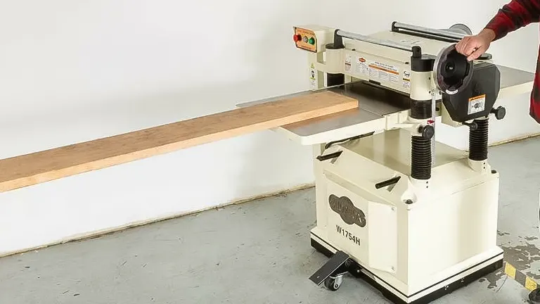 Shop Fox W1754S 20-Inch Planer with Spiral Cutterhead in use in a workshop.