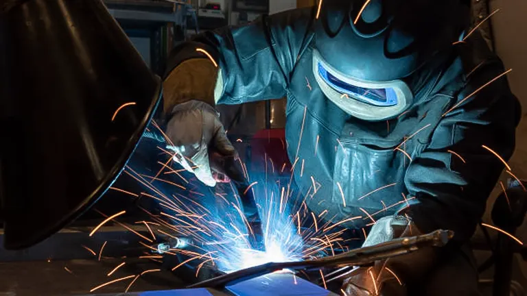 Sparks flying from a welder working on a metal project