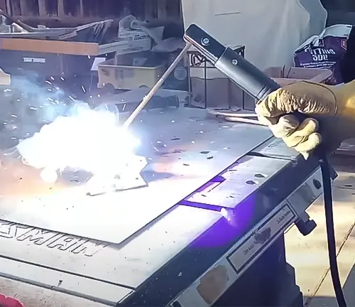 Person welding with a YESWELDER Stick Welder 205Amp Digital Inverter IGBT Welding machine
