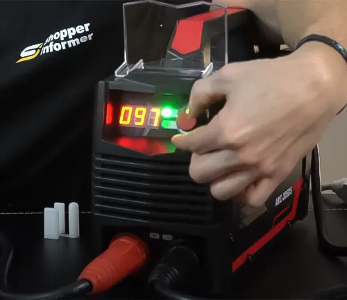 Person adjusting settings on a YESWELDER Stick Welder 205Amp Digital Inverter IGBT Welding machine