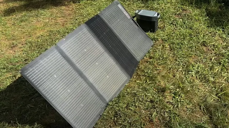 A solar panel on grass.