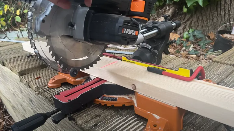 WORX WX845L Miter Saw cutting wood on deck
