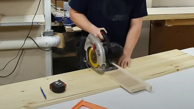 Person using a SKIL brand circular saw to make a clean cut on a wooden plank