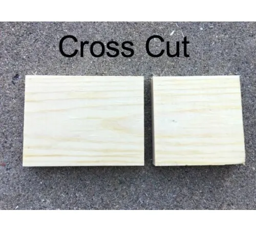 Two wooden planks with a clean cross cut, placed on a grey surface