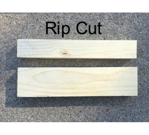 Two wooden planks demonstrating a rip cut on a grey surface