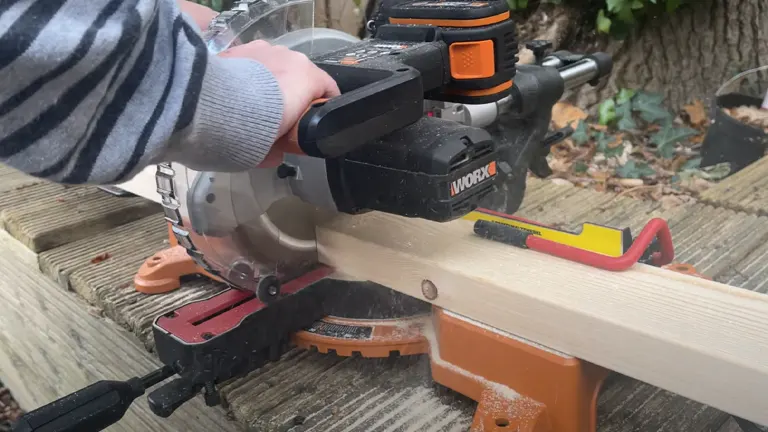 WORX WX845L 20V 7.25” Miter Saw cutting wooden plank