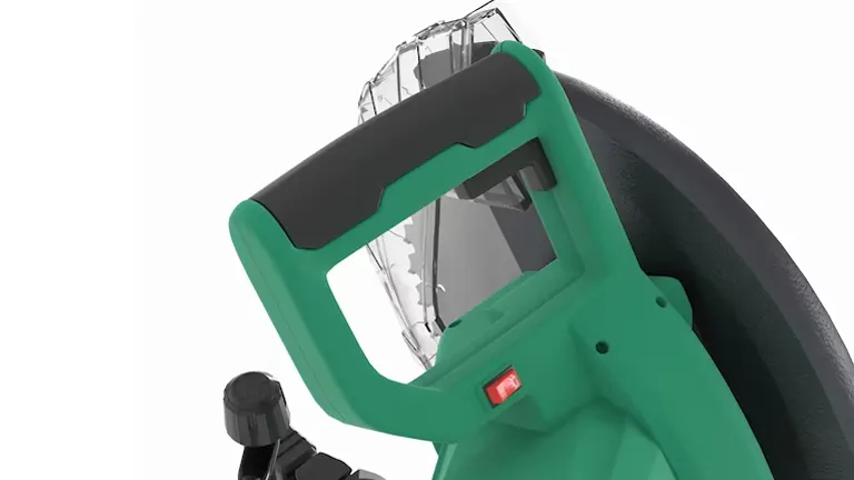 Close-up of a green and black Metabo HPT C12FDHB 12” Dual-Bevel Compound Miter Saw focusing on the handle and blade guard