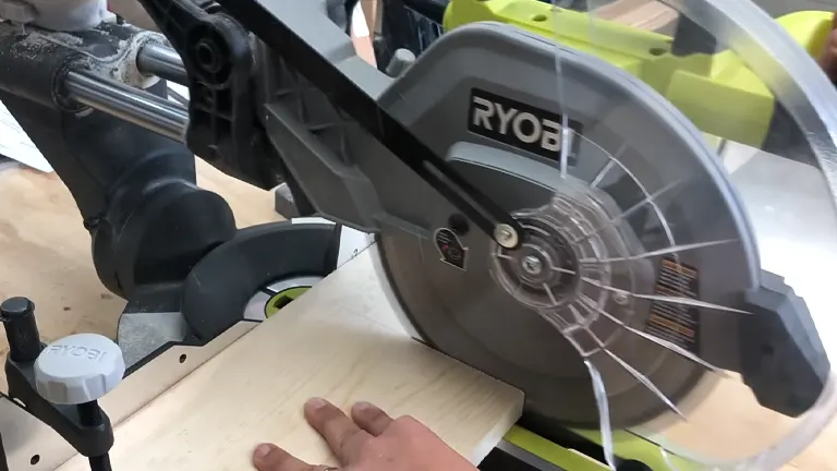 Person using miter saw in workshop