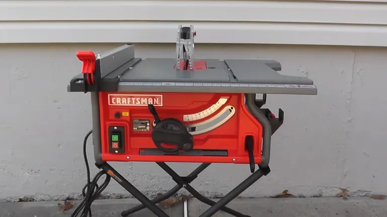 Red and black Craftsman 10-inch portable table saw with blade guard assembly, mounted on a black X-shaped stand, positioned outdoors