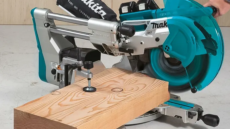 Makita 36V LXT Brushless 12” Dual-Bevel Sliding Compound Miter Saw with Laser Kit cutting through wood