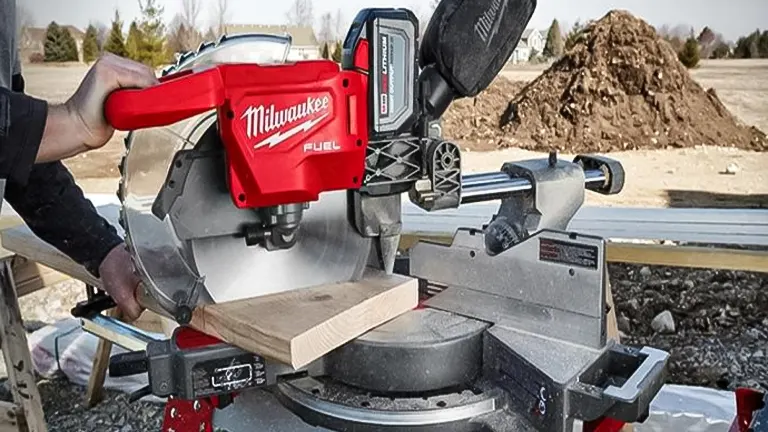Person using a Milwaukee M18 FUEL 12” Dual Bevel Sliding Compound Miter Saw on a construction site