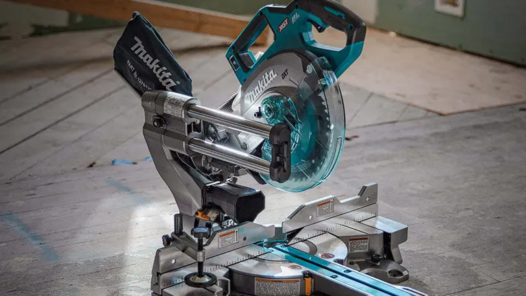 Makita 40V Max XGT 8-1/2” Dual-Bevel Sliding Compound Miter Saw on a wooden floor in a workshop