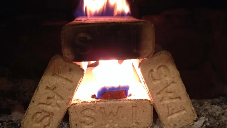 Three Bio Block Briquettes burning with a bright flame in a fireplace