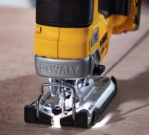 Close up of a DeWalt reciprocating saw on a wooden surface