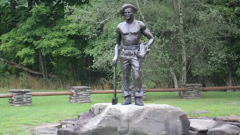 Statue of a person with a tool at Letchworth State Park