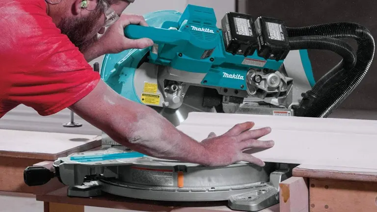 Person Using Makita Miter Saw in Workshop