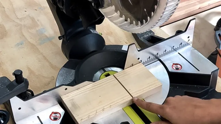 Person using a miter saw to make precise cuts on a wooden board in a workshop
