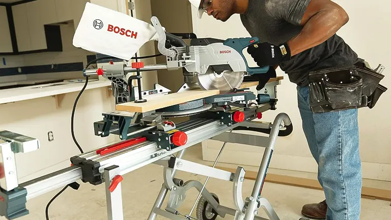 Person using a BOSCH CM8S 8-1/2” Single-Bevel Sliding Compound Miter Saw in a workshop