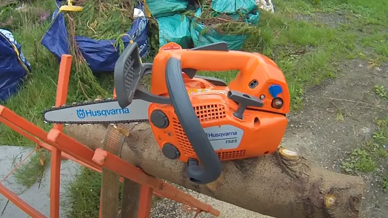 Husqvarna T525 Chainsaw placed on a log in an outdoor setting