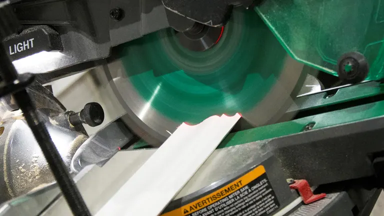 Close up of a Metabo HPT C10FSHCT 10" Dual-Bevel Sliding Compound Miter Saw with Laser in action