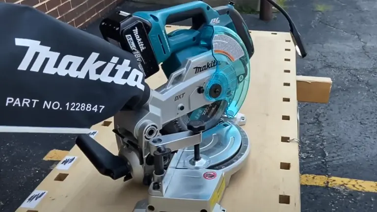 Makita 18V LXT 6-1/2” Compact Dual-Bevel Compound Miter Saw with Laser on a wooden surface