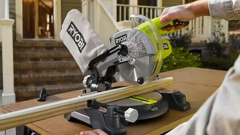 Ryobi P553 18V ONE+ 7-1/4” Compound Miter Saw in use on a wooden plank