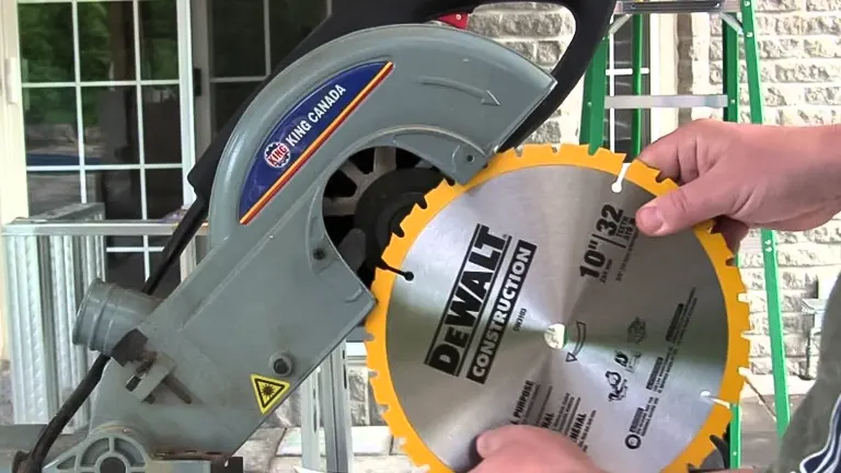 Person adjusting blade on a DeWalt miter saw for accurate cuts