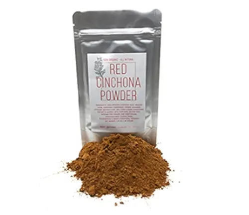 Package of Red Cinchona Powder with spilled powder in front