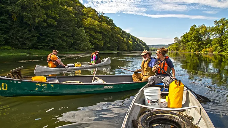 People canoeing in Allegheny National Forest on a clear day