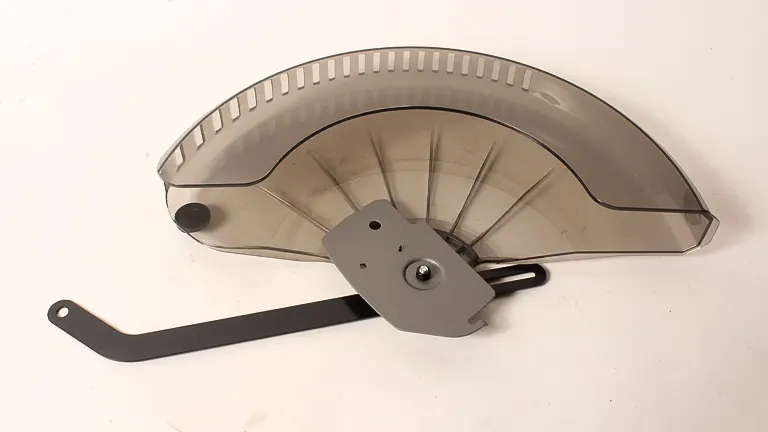 Silver miter saw blade guard with black handle on a white background