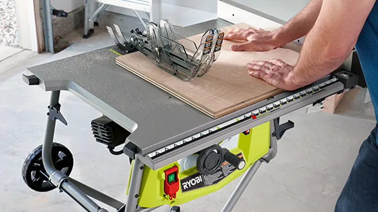 man using Ryobi 10 in. Table Saw with Steel Stand (RTS23) 