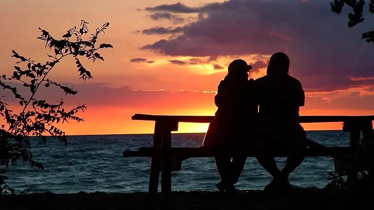 Silhouette of two people enjoying a sunset at Presque Isle State Park