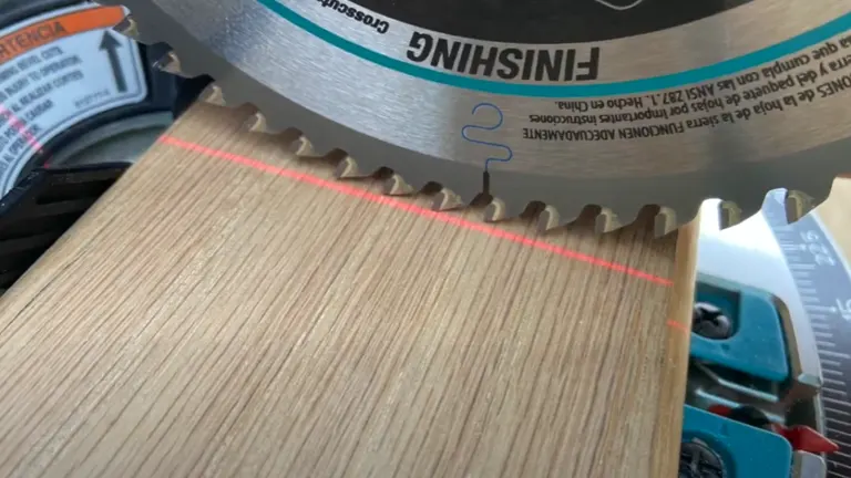 Close up of Makita 18V LXT 6-1/2” Compact Dual-Bevel Compound Miter Saw with Laser cutting wood