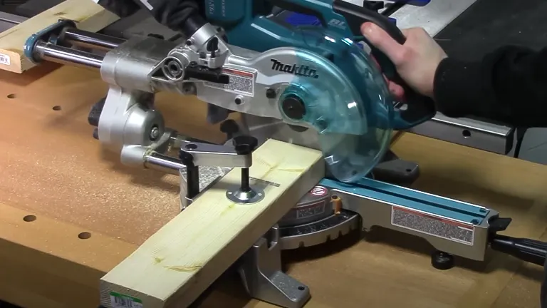 Makita 36V LXT Brushless 7-1/2" Dual Slide Compound Miter Saw in use on a wooden workbench