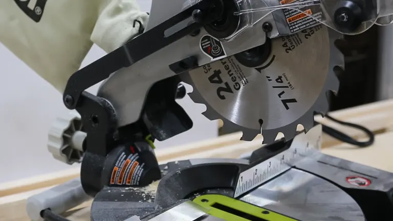 Ryobi TS1144 9 Amp Corded 7-1/4” Compound Miter Saw in use on a wooden surface