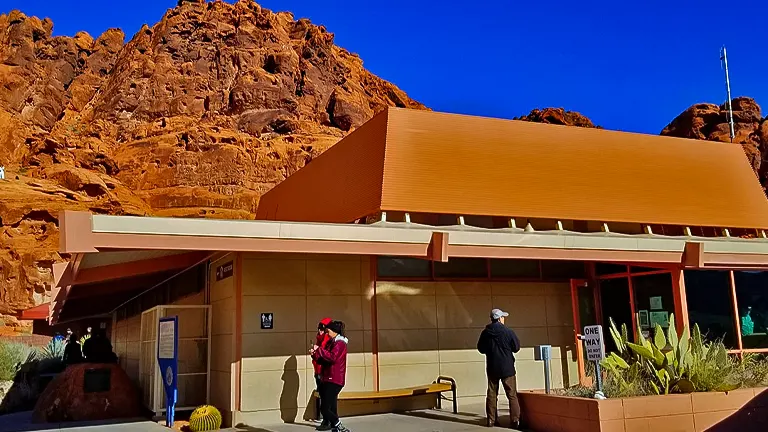 Visitors center at Valley of Fire State Park with rocky red mountains in the background