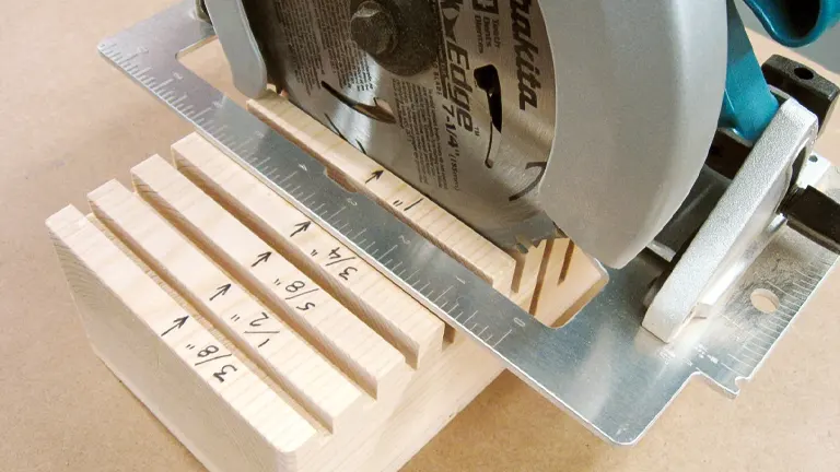 Blue and silver circular saw cutting a wooden board with measurement markings