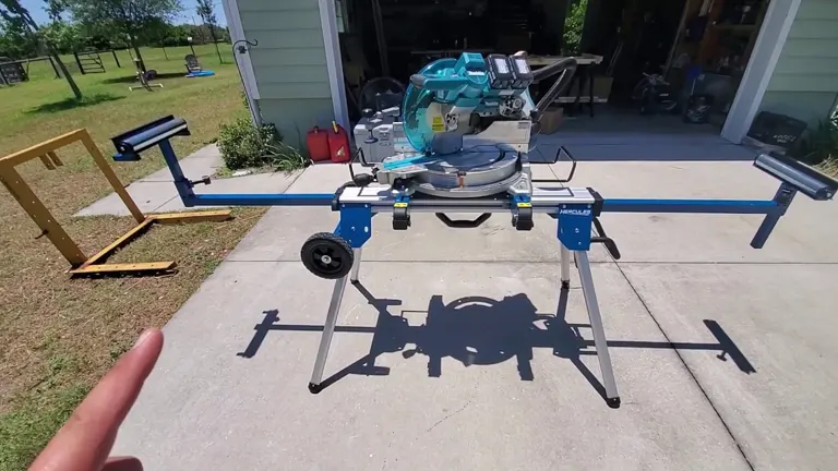 Hercules 550 lb. Universal Aluminum Mobile Folding Miter Saw Stand with a blue saw in a driveway