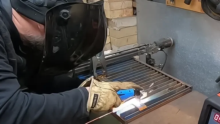 Person using an AMICO MIG-160 Flux Stick TIG Arc 3-in-1 Welder for welding