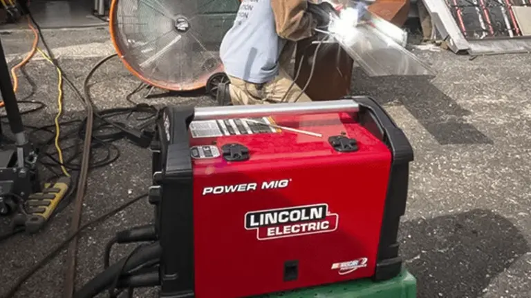 Lincoln Electric POWER MIG welder machine in use at a workshop