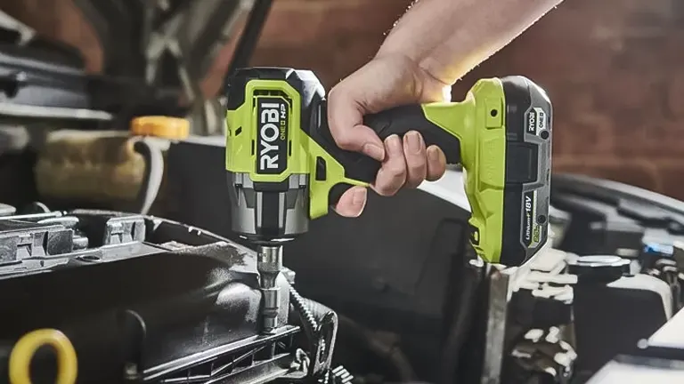 Ryobi 18V One+ 3/8-Inch Drill Driver being used on a car engine
