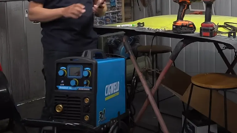 Person standing next to a Cigweld Weldskill 3-in-1 Welder in a workshop
